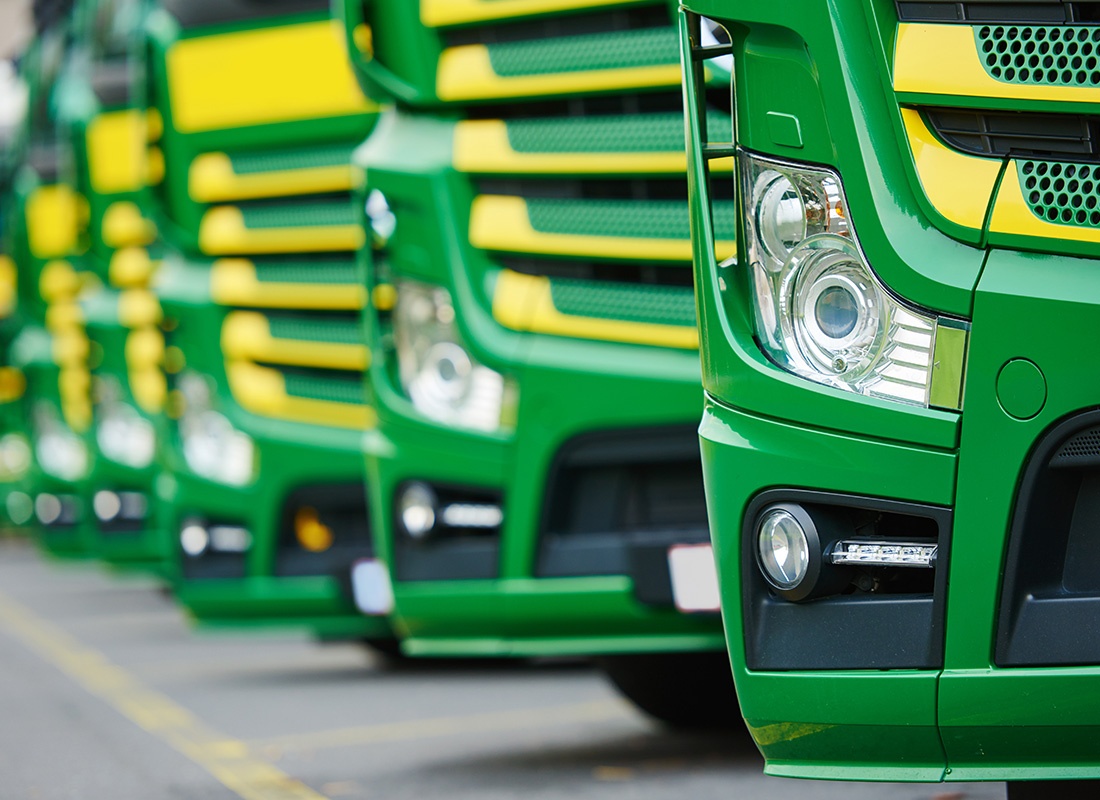 Business Insurance - Fleet of Green Trucks Parked Together in a Row